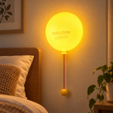 Wall-mounted silicone balloon night light with red pull cord